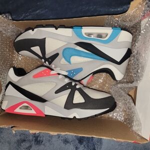 Nike Air Sneakers with Blue and Pink Accents